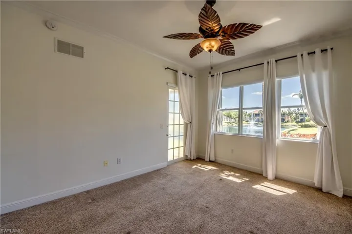 Has pretty fan light with water views, French door to lanai & plush, soft carpet.