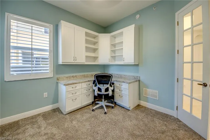 3rd. bedroom has closet plus built-in custom desk, new carpeting & plantation shutters.