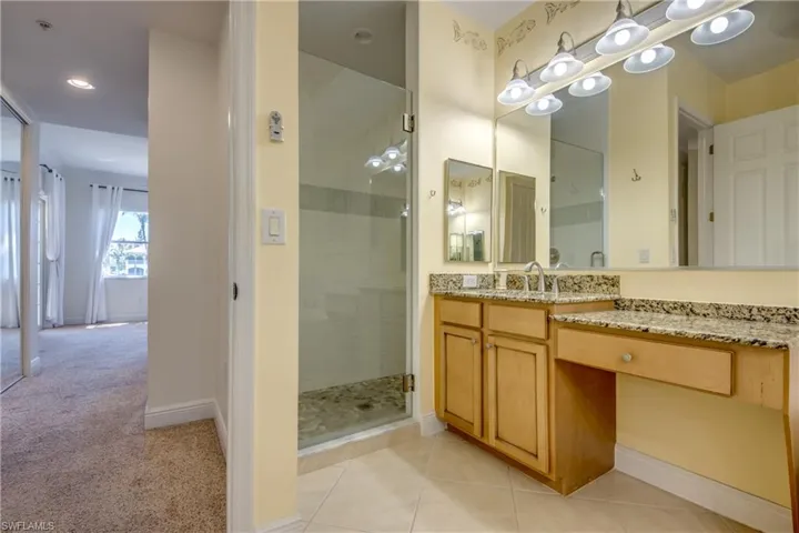 Beautiful updated tiled walk-in shower & pretty designer colors.