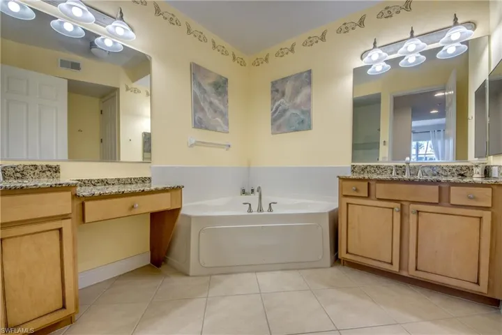 Updated, complete with granite countertops, dual vanities/sinks, soaking tub.