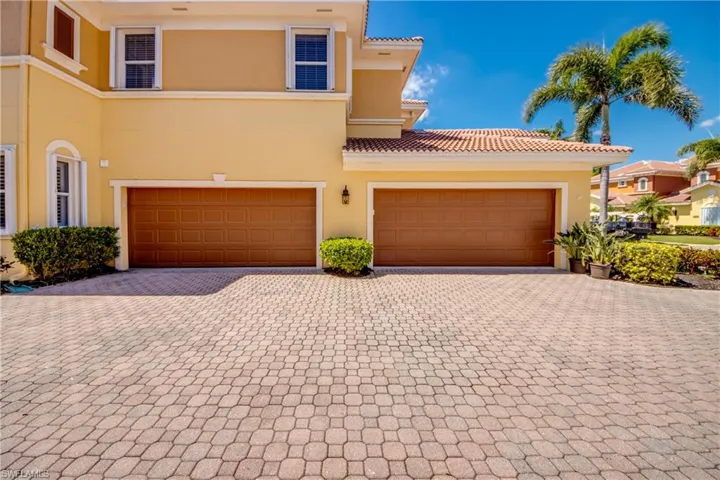Your attached 2 car garage with extra built-in storage.