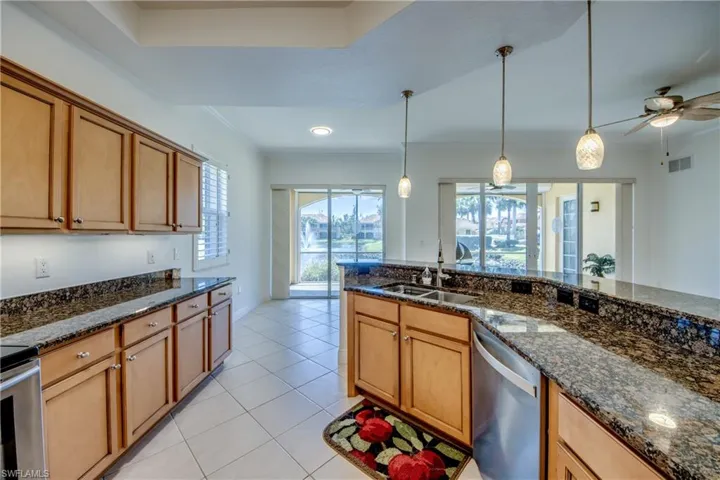 Spacious kitchen with breakfast room & sliders to your lanai with water views.