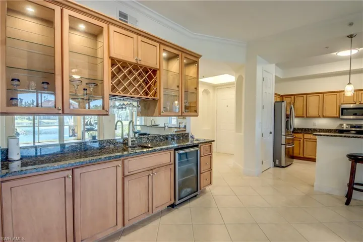 Custom built-in wet bar with wine cooler & wine rack.
