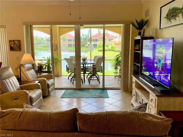 Great/Living Room with designer neutral colors with lots of sliders too screened-in lanai plus fantastic waterview!!