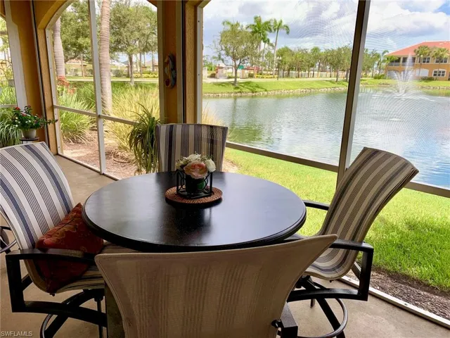 Screened-in Lanai when it was furnished featuring water view with fountain! Very pretty!
