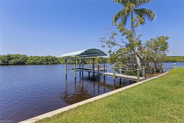 Updated boat dock (2022) with seating area to relax and take in serene canal and nature views
