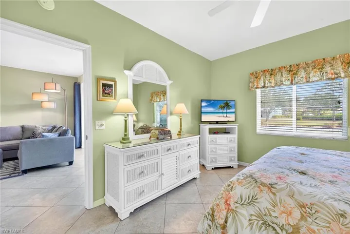 Bedroom featuring light tile patterned flooring and ceiling fan
