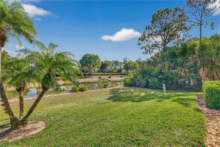 View of grassy yard featuring a water view