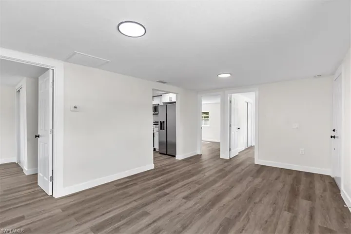Empty room featuring hardwood / wood-style flooring