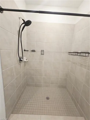 Master Bathroom featuring a tile shower