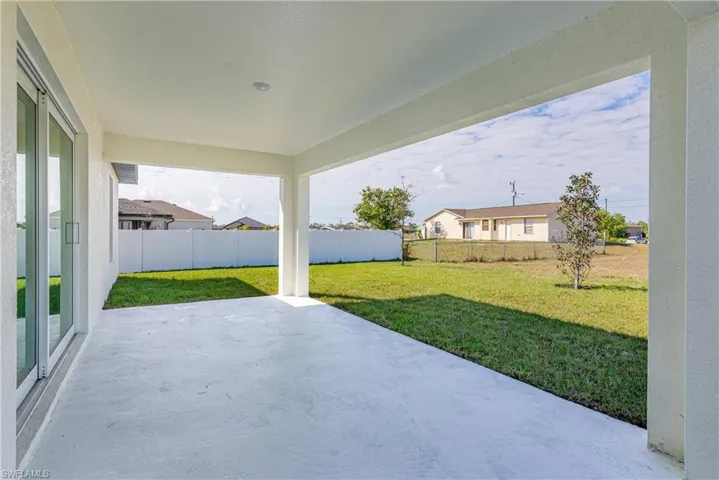 View of patio with a fenced backyard and a residential view