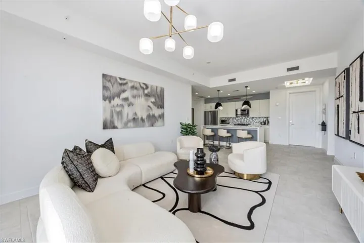 Living area with a chandelier and recessed lighting