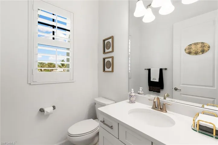 Bathroom with vanity and a chandelier
