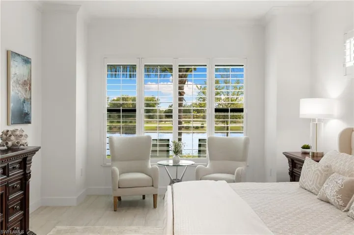 Bedroom featuring a water view and ornamental molding