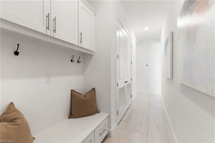 Mudroom with baseboards and recessed lighting