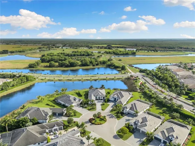 Aerial perspective of suburban area with a large body of water
