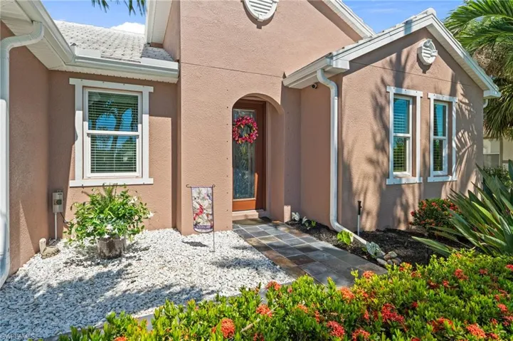 Doorway to property with stucco siding