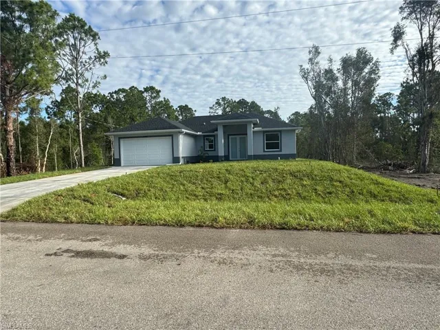 View of front of property featuring a garage