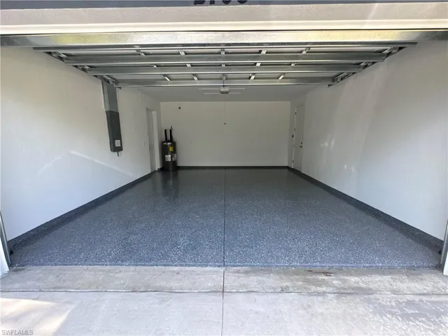 Garage featuring water heater