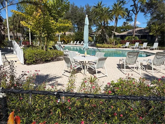 Community pool with a patio area