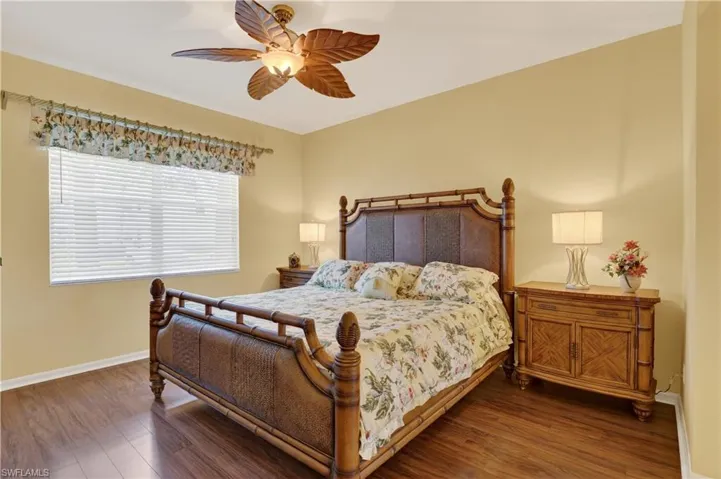 Bedroom featuring wood finished floors and a ceiling fan