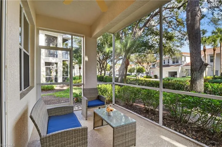 Unfurnished sunroom featuring outdoor lounge area, ceiling fan, and healthy amount of natural light