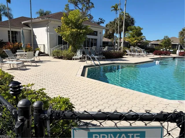 Community pool featuring a patio