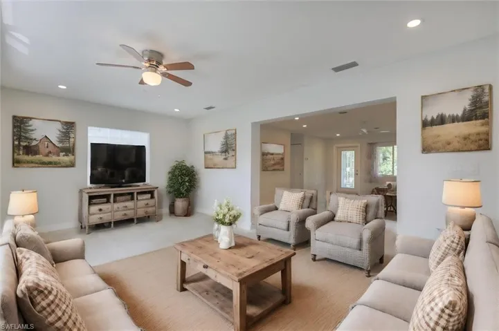 Living room featuring ceiling fan
