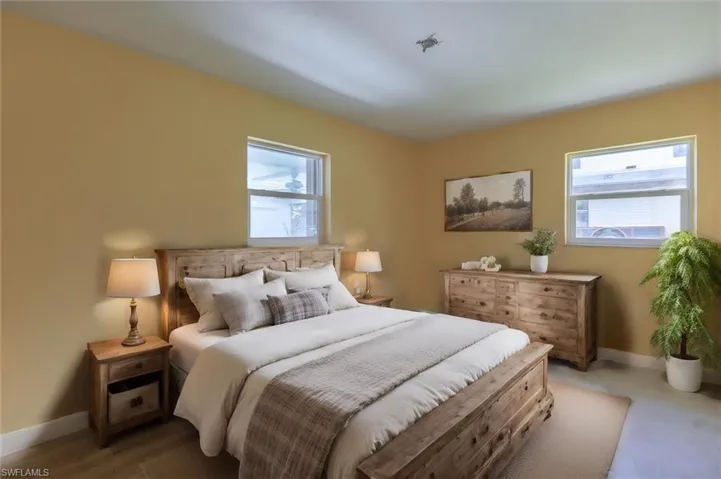 Bedroom with multiple windows