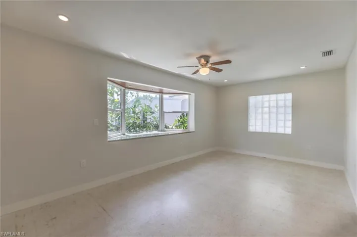 Spare room with ceiling fan