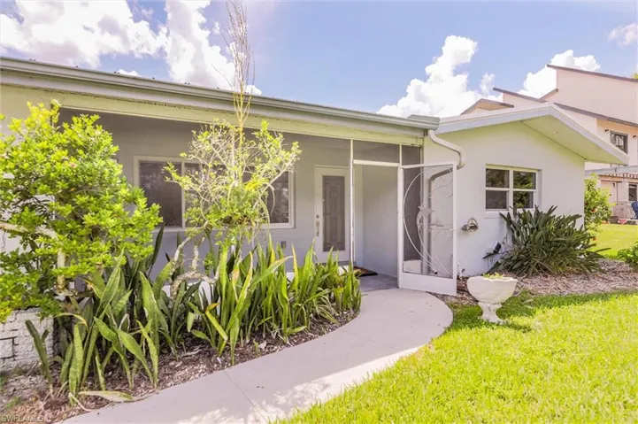 View of front of property with a front lawn