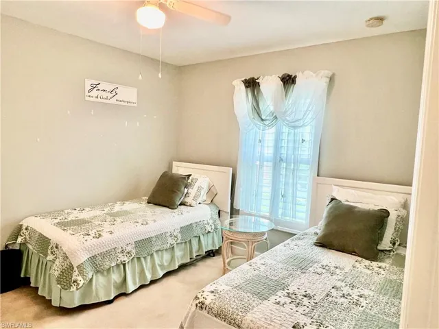 Bedroom featuring carpet flooring and ceiling fan