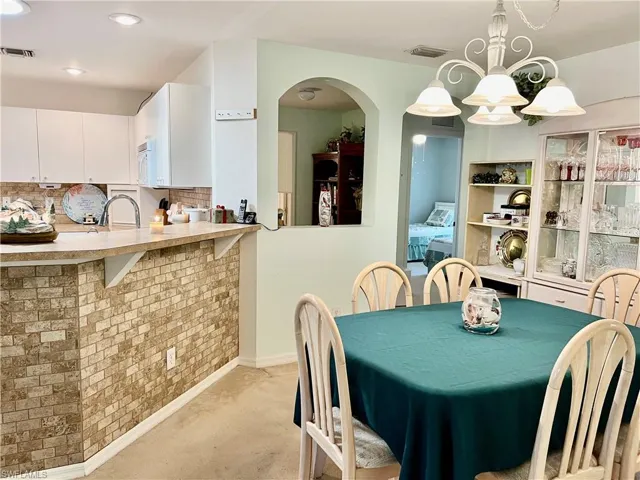 Dining area with sink and breakfast bar