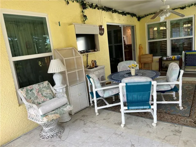 View of patio with ceiling fan