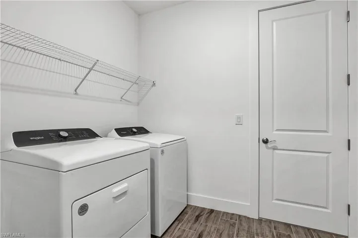 Laundry room with washer and gas dryer