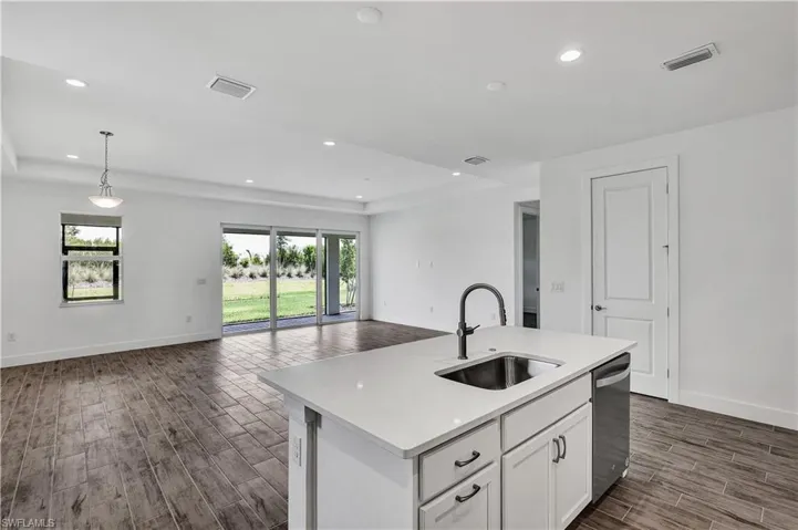 Open-concept floor plan with kitchen layout pictured