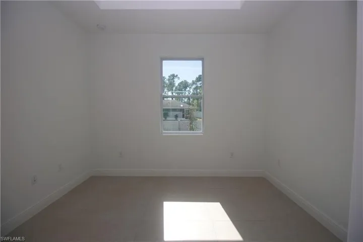 Bedroom featuring light tile patterned flooring