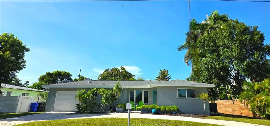 Mid-century home with circular driveway.