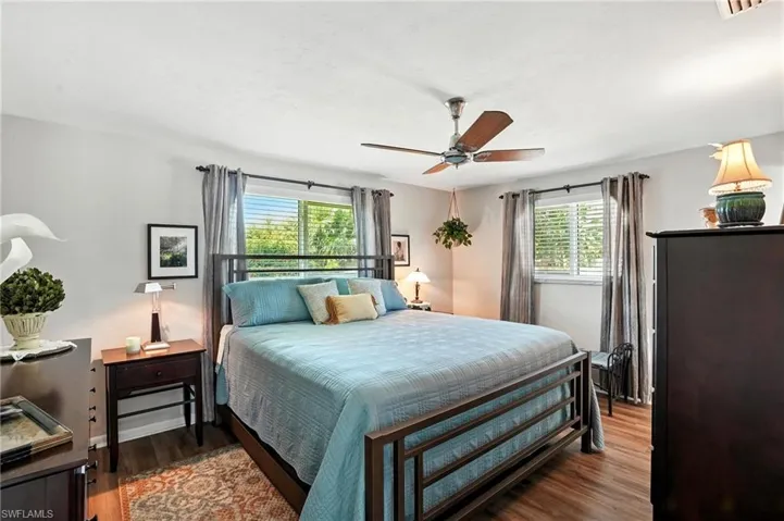 Bedroom featuring wood finished floors and ceiling fan