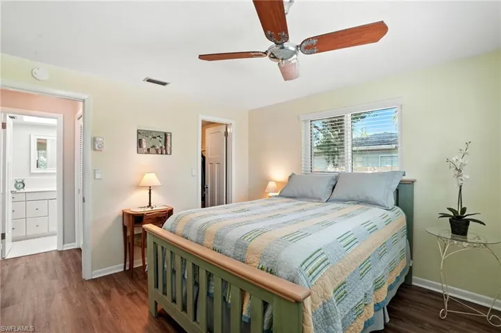 Bedroom with wood finished floors and a ceiling fan