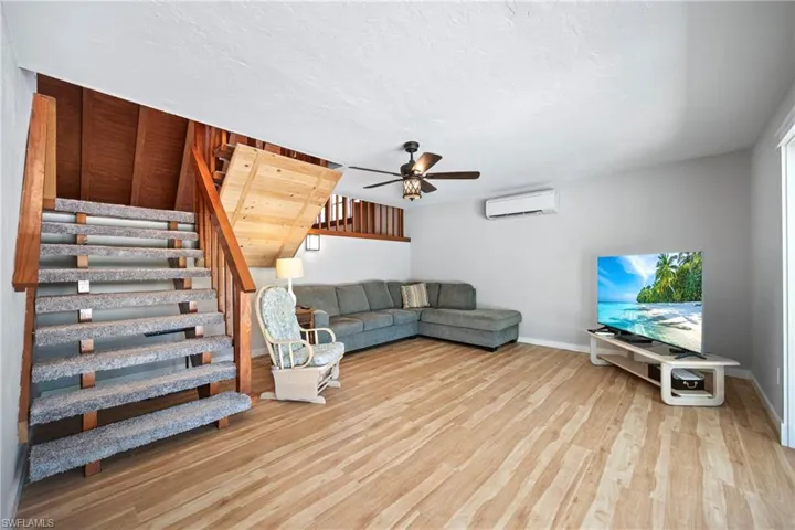These stairs come down from the great room and is currently a sitting room and could be a game room
