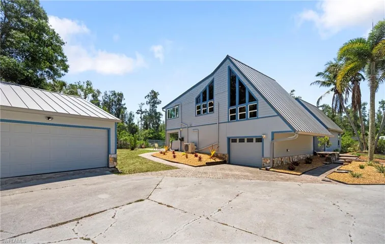one car garage attached and the large detached garage 28'x33'