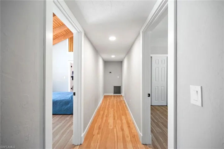 Primary bedroom on the left, two additional rooms on the right currently a workout room