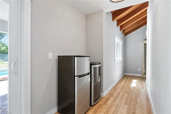 This hall leads from the Hobby room to the gues bathroom.  The wine cooker and small fridge stay with home