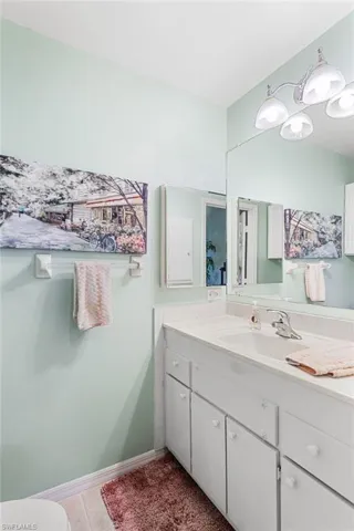 Bathroom featuring vanity and light tile patterned floors