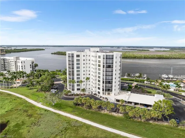 Aerial view of apartment complex and a nearby body of water