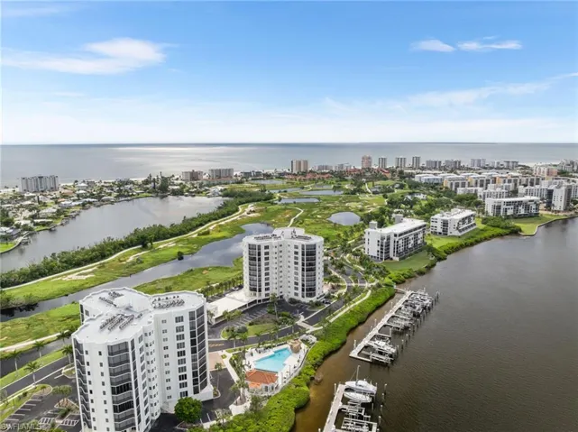 View of urban area featuring a large body of water and a pool