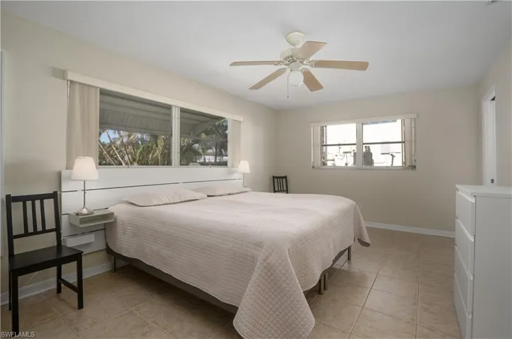 Bedroom featuring ceiling fan and light tile patterned floors