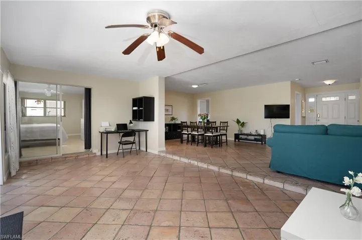 Living room featuring ceiling fan