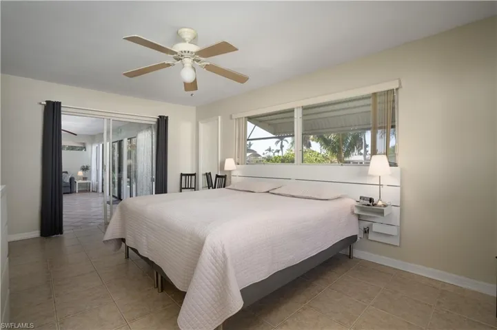 Tiled bedroom with ceiling fan